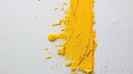 Fototapeta premium Yellow paint smudge on a white surface