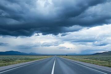 Naklejka premium Empty highway in a remote area, with dramatic cloud formations overhead, creating a sense of isolation and grandeur 