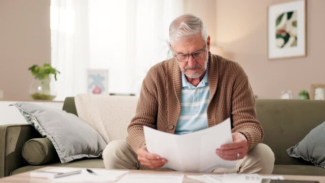 Senior man, home and stress with documents in living room for finances on water or electricity bills. Male person, sofa and disappointed with compare invoice for bank loan, mortgage and interest rate