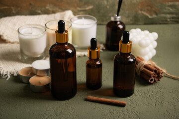 Amber Dropper Bottles with Spa Essentials and Candles on Rustic Background for Natural Skincare Mockup