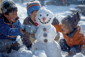 Asian dad and children building a snowman on a snowy winter day, dressed warmly