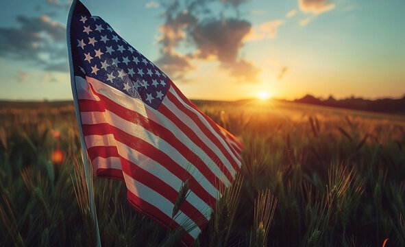 Close-Up of Hands Holding American Flag Over Wheat Field at Sunset