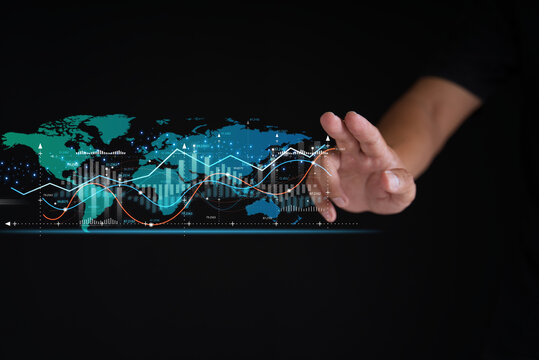 Businessmen point to a line in the growth graph of the business with a virtual screen with stock market changes Business strategy development growing growth trend, and opportunity business investment.
