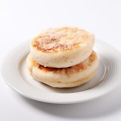 Two toasted English muffins on a white plate