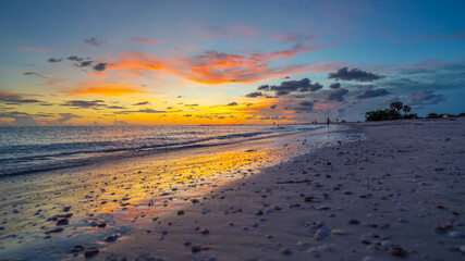 Sunset. Colorful sky and ocean after sunset. Florida Gulf of Mexico. Honeymoon Island State Park. Horizontal seascape. Tropical nature. Beach vibes. Spring, summer, autumn fall vacation on ocean beach © Anna