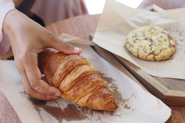 top view of hand pick fresh baked croissant 