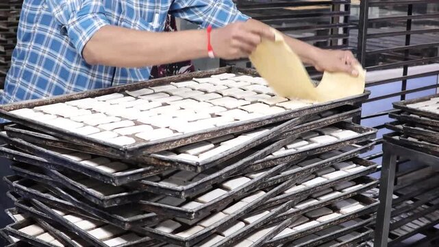 Malegaon, India 17th July 2024: Delicious fresh puff pastries also Khari is a light and fluffy biscuit often served in Indian homes with chai. Food and breakfast. Visuals of Indian bakery.