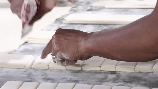 Malegaon, India 17th July 2024: Delicious fresh puff pastries also Khari is a light and fluffy biscuit often served in Indian homes with chai. Food and breakfast. Visuals of Indian bakery.