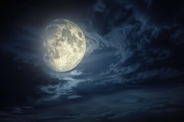Full moon illuminating dark, dramatic clouds in a night sky