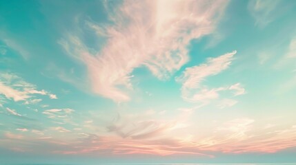 Obraz premium Morning sky with soft pastel colors and wispy clouds