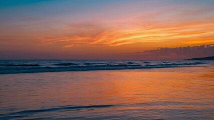 Naklejka premium A vibrant sunset over the ocean with rolling waves and billowing clouds