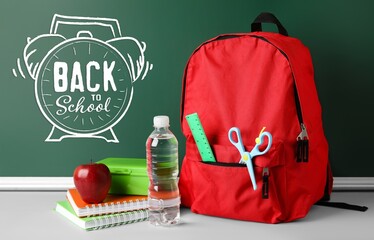 Banner with stationery, lunchbox, backpack and text BACK TO SCHOOL in classroom