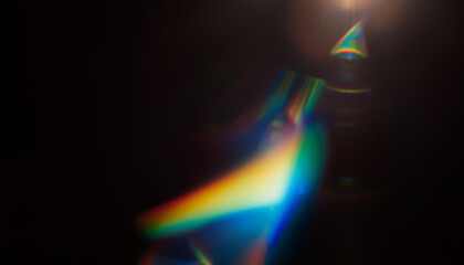 prism light leak texture for photo overlay and effect. lens flare in abstract background. bokeh effect with glow and magical lights on black background.