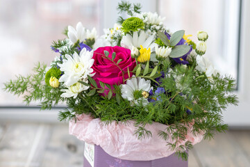 close-up of a multi-colored bouquet of roses and chrysanthemums. soft focus