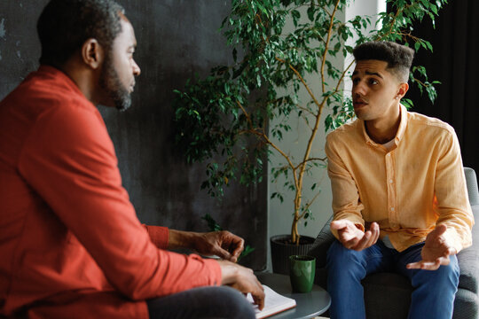 Two shot. Creative entrepreneurs having conversation in loft office