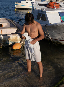 Man Wringing Out Clothes