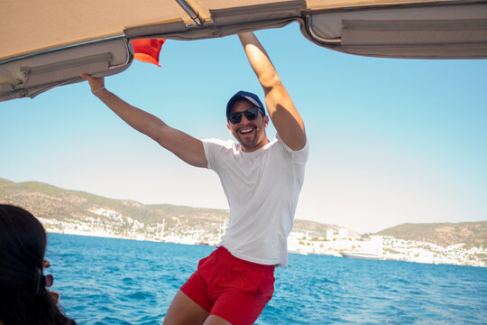 Man standing on a boat in Bodrum, Turkey