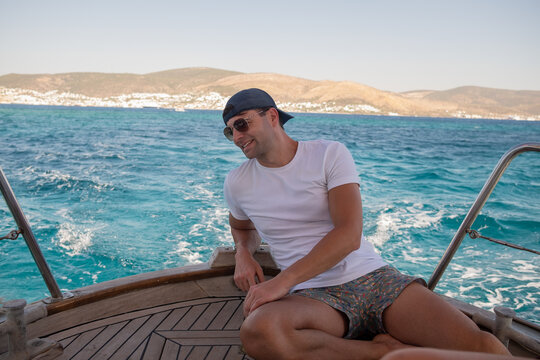Man sitting on a boat in Bodrum, Turkey
