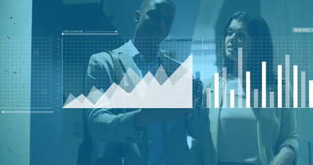 Image of financial data processing over diverse colleagues discussing work in office