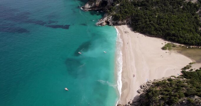 Boats In Beautiful Blue Sea At Cala Sisine In Sardinia, Italy.
