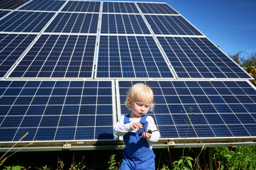 Small kid learning how to use tools. Cute toddler interested in how does srewdriver work. Curious...
