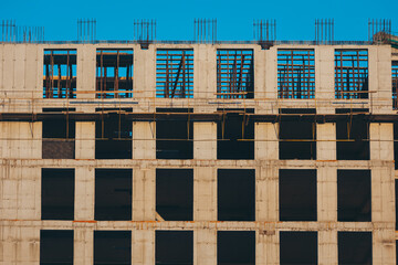 Unfinished cement building at a construction site. Construction of concrete building using...