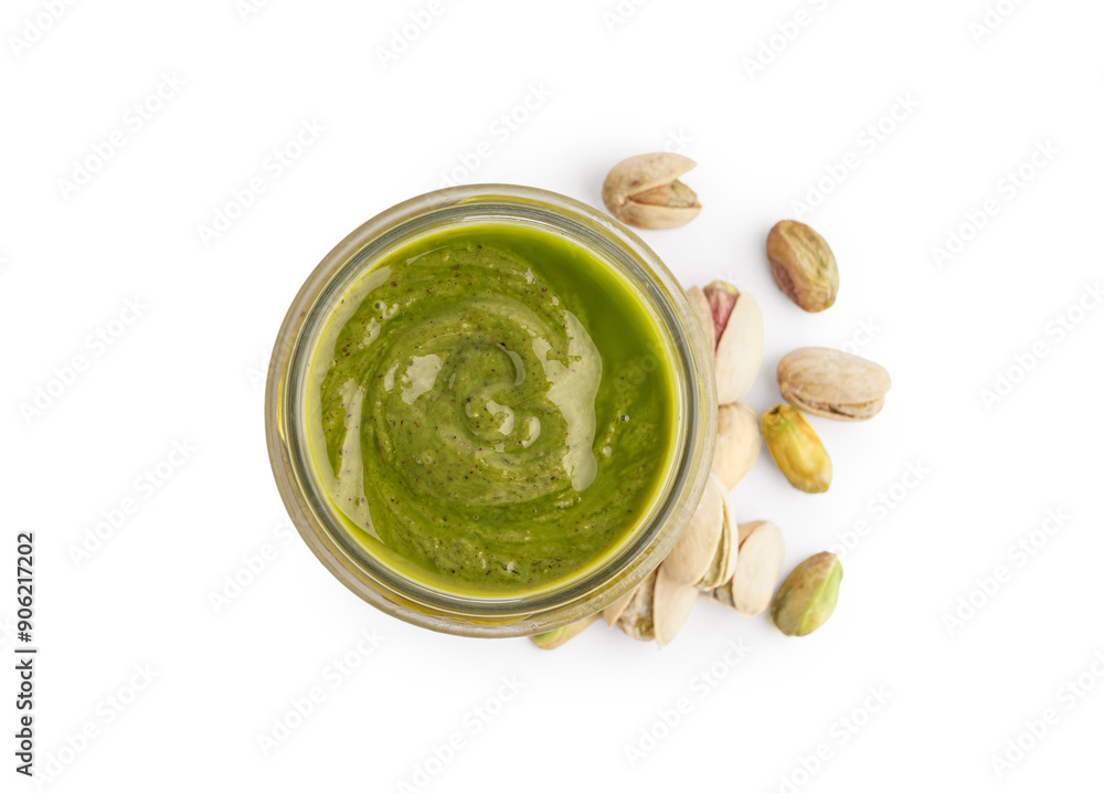 Wall mural Tasty pistachio paste in jar on white background