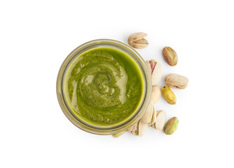 Tasty pistachio paste in jar on white background