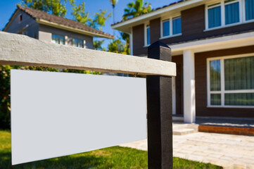 Fototapeta premium Modern Suburban Home for Sale with empty Sign for Copy Space