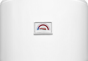Close-up temperature indicator of tanked boiler. Temperature gauge of regular household budget water heater. Thermostat or thermometer of home heating system. Temp indicator of common water heater