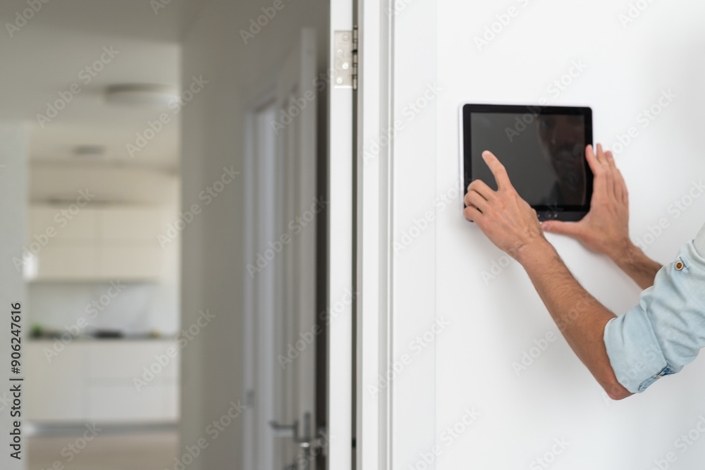 Poster automation, internet of things and technology concept - man looking at tablet pc computer at smart h