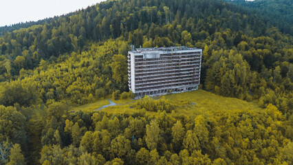 Deserted hotel building in nature