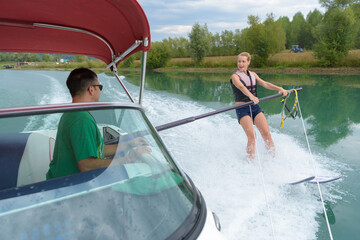 preparing a woman for water skiiing