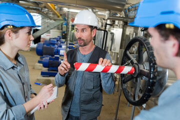 foreman warning new recruits of danger in factory