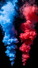 Fototapeta premium Vibrant blue and red paint swirl together in water, forming dynamic patterns suspended against a dark backdrop