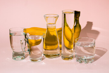 Bananas behind glass vessels filled with water. Distorted reflection.