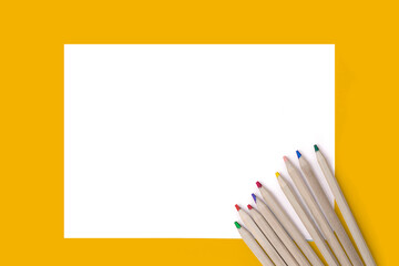 Sheet of paper, colour pencils template for art, mock up for design, clean empty blank copy space background.