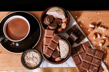 Chocolate chip cookies, dark and white chocolate bar, small bowl of oatmeal and nuts. International...