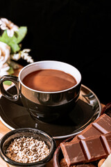 Chocolate chip cookies, dark and white chocolate bar, small bowl of oatmeal and nuts. International Chocolate Day.