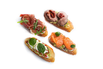 different types of bruschetta. With salmon, meat, soft cheese, herbs