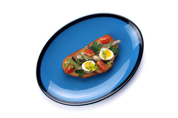 Delicious bruschetta with fish, cheese and herbs