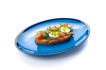 Delicious bruschetta with fish, cheese and herbs