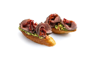 Delicious bruschetta with meat, cheese and herbs