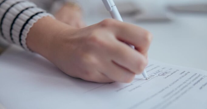 Person, hands and signature on document in office for professional agreement, license and financial terms. Closeup, author and paperwork for initial on publishing contract and manuscript deadline.