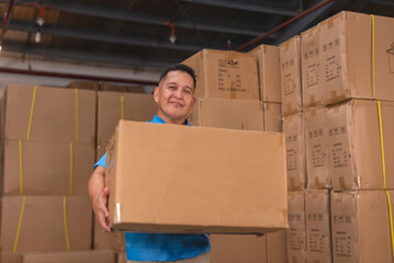A dependable and reliable warehouse worker carrying a large box with ease.