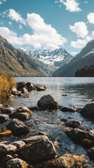 Rocky Shoreline with Mountain View and a Tranquil Lake