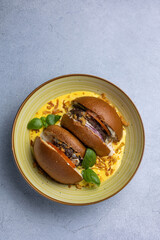 A delicious hamburger on a gray background.