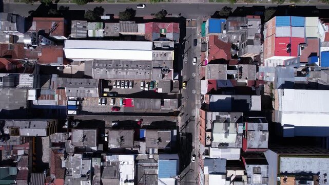 Top Down Aerial View of Street Traffic and Buildings in Residential Neighborhood of Colombian City