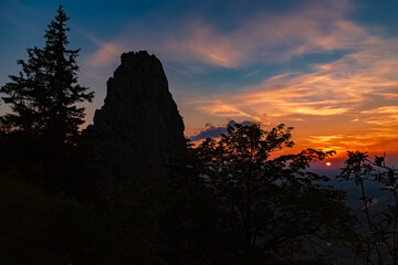 Alpine sunset or sundowner with the silhouette of the legendary Staffelstein rock at Mount Kampenwand, Aschau, Chiemgau, Rosenheim, Bavaria, Germany