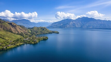 Aerial View of a Serene Lake Surrounded by Lush Mountains